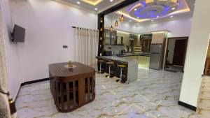 a kitchen with a counter and a bar in a room at A&T villa in Jaffna