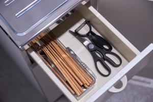 a drawer with a pair of scissors and matches at Wan Kumano by WhyKumano in Nachikatsuura