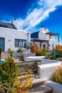 a villa with a swimming pool and a house at L'abri in Langebaan