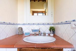 a bathroom with a sink and a mirror at CASA LORY Poggio Murella in Poggio Murella +56 photos