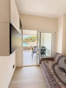 a bedroom with a bed and a view of the ocean at Pareti di mare in Capoliveri