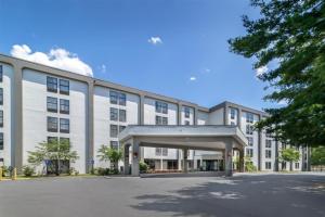 a large building with a parking lot in front of it at Hampton Inn Albany-Wolf Road in Albany