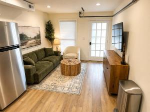 a living room with a couch and a table at The Riverwood Retreat in St. Charles