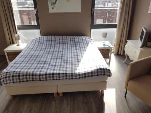 Postel nebo postele na pokoji v ubytování B&B Beach Inn