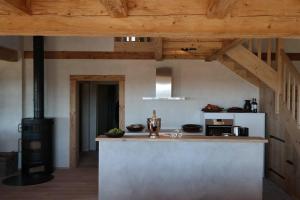 a kitchen with a counter and a stove at Romantikhütte Rothaarsteig in Schmallenberg