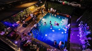 an overhead view of people in a swimming pool at Villa Navin Beach Residence in Jomtien Beach +289 photos