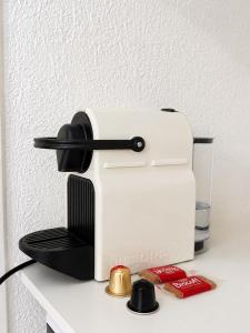 a sewing machine sitting on top of a counter at Cosy T1 Bis climatisé in Toulouse