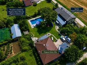 an aerial view of a house with a swimming pool at Pegasus Pool Villas Kavala in Kavála