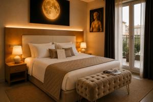 a bedroom with a large bed and a window at Syraka Design Rooms & Suites in Syracuse