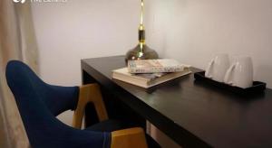 a desk with a chair and a lamp and a book at Dali Five Elements Hostel in Dali Ancient Town +192 photos