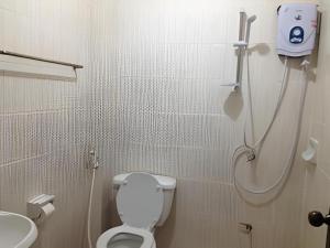 a bathroom with a shower and a toilet and a sink at Senesouk Hotel in Vientiane +30 photos