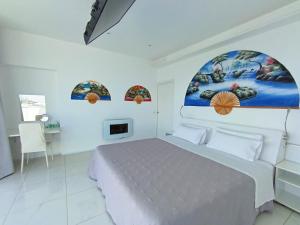 a white bedroom with a bed and three windows at Villa Luxury Paradise in Salobreña +97 photos