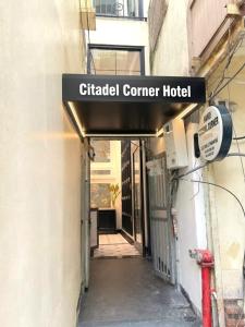 a sign for a clinical corner hotel on a building at Hanoi Citadel Corner in Hanoi