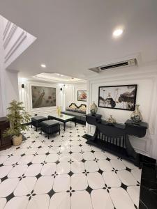 a living room with a black and white tiled floor at Hanoi Citadel Corner in Hanoi