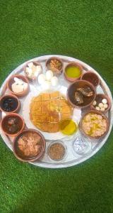 a plate of food on top of the grass at الشريف in Irbid +37 photos