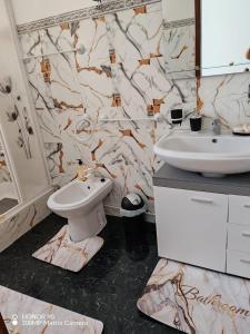 a bathroom with a toilet and a sink at Villa Luisa Torres in Argozelo +35 photos