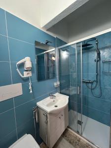 a bathroom with a toilet and a sink and a shower at B&B Da Vincenzo e Teresa in Bella
