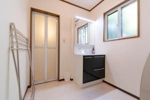 a bathroom with a sink and a mirror at N-Stream Old Karuizawa West in Karuizawa +63 photos