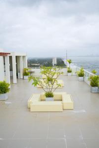 a building with a table with plants on it at Beachfront Bliss Ocean Views & Sunset Views 
