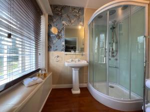 a bathroom with a shower and a sink and a tub at Chatton Park House Hotel Adult Only in Chatton +52 photos