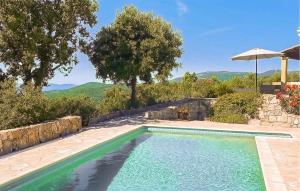 a swimming pool in front of a house at Villa Pisicne in Mons +10 photos