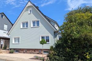 a white house with a gambrel at Villa Sand in Bad Emstal