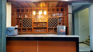 a bar in a room with a lot of bottles at Yiganda Hotel, Ethiopia in Bahir Dar +21 photos