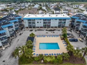an aerial view of a building with a pool at Oceanfront 1BR • Top-Floor Balcony Views • Cherry Grove • Sea Cabin 304-A in Myrtle Beach