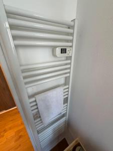 an empty refrigerator with its door open in a room at Le Petit Chagnotin in Chagny