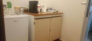 a kitchen with a counter with a coffee maker on it at Affittacamere Casa Sermide in Caniparola di Fosdinovo