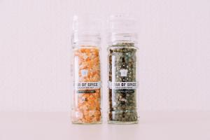 two glass jars filled with different types of seeds at Chic 1 Bedroom Space Near Nakasu in Fukuoka