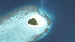 an island in the ocean with a small island at Faafu View Maldives in Maldive Islands