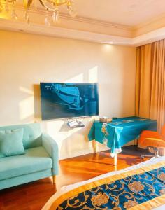 a living room with a blue table and a couch at Pu Yu Apartment in Shanghai