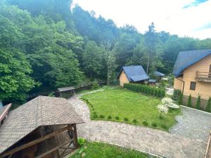 an aerial view of a garden with a house at Rika House in Sinyak