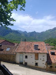 a view of a house with mountains in the background at Benaki 92B in Ladines