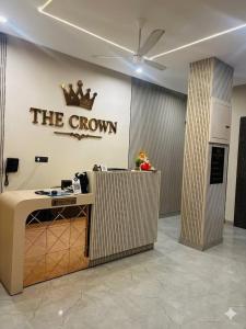 an office with a crown sign on the wall at THE CROWN HOTEL & restaurants in Farrukhnagar