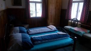 Postel nebo postele na pokoji v ubytování Pension Rybářská Bašta + 4 fotografie