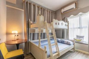 a bunk bed with a ladder in a room at Yunting Resort in Huadu +288 photos