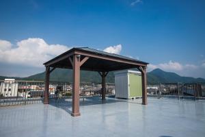 a pavilion on top of a roof with a view of a city at Numazu Royal Retreat 201 in Numazu