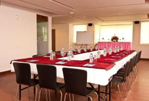 a large conference room with a long table with chairs at Hotel Colva Kinara in Colva +215 photos