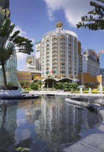 a large building with a fountain in front of it at Hotel Lisboa in Macau