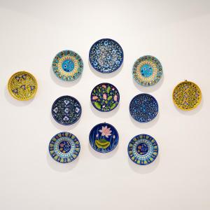 a group of colorful plates on a white background at Chez Lavania - A Boutique Stay in Udaipur +43 photos
