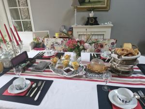 a table with a table set with food on it at la guichardaye in Tréal