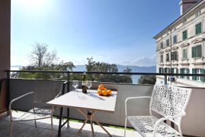 a white table and chairs on a balcony with a view at Jelena - Spacious Sea View Apartment - Old Town Zadar in Zadar