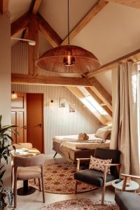 a bedroom with a bed and a vaulted ceiling at Granny's B&B in Kapelle