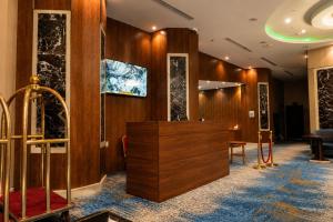 a lobby of a hotel with a reception desk at Maysan Al Safa Hotel in Mecca