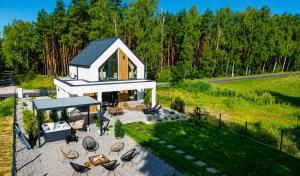 an overhead view of a house with a patio at Bosarosa Forest & Lake Villa z jacuzzi wanna SPA in Laski Małe