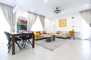 a living room with a table and a couch at Nova, Sky Suites in Accra