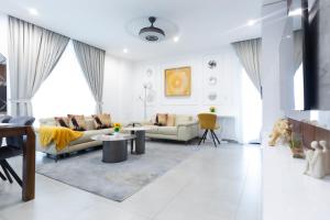 a living room with two couches and a table at Nova, Sky Suites in Accra