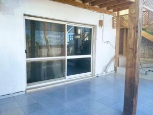 an empty room with a window and a tile floor at Quiet place in Dahab +1 photo